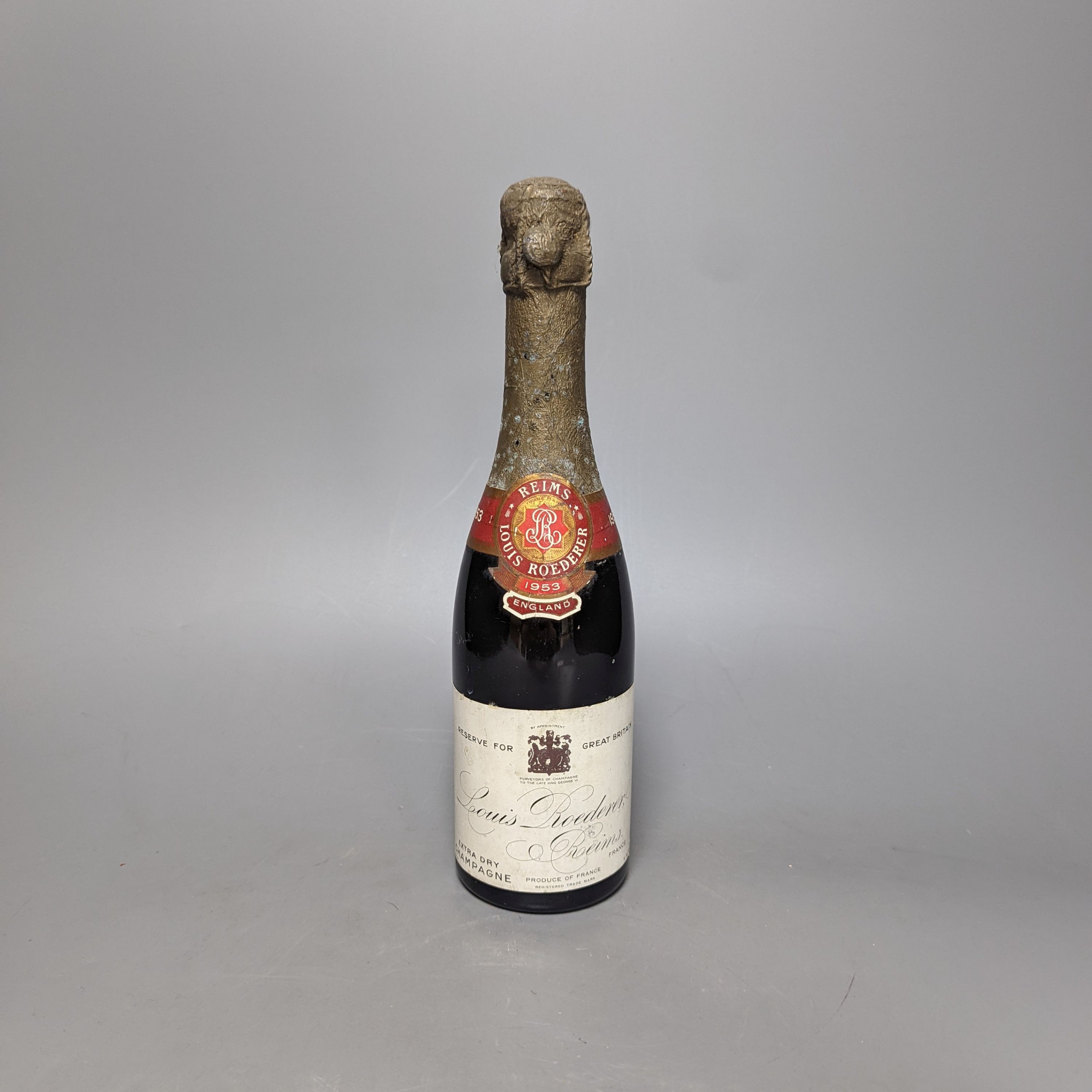 One half bottle of 1953 Louis Roederer extra dry champagne